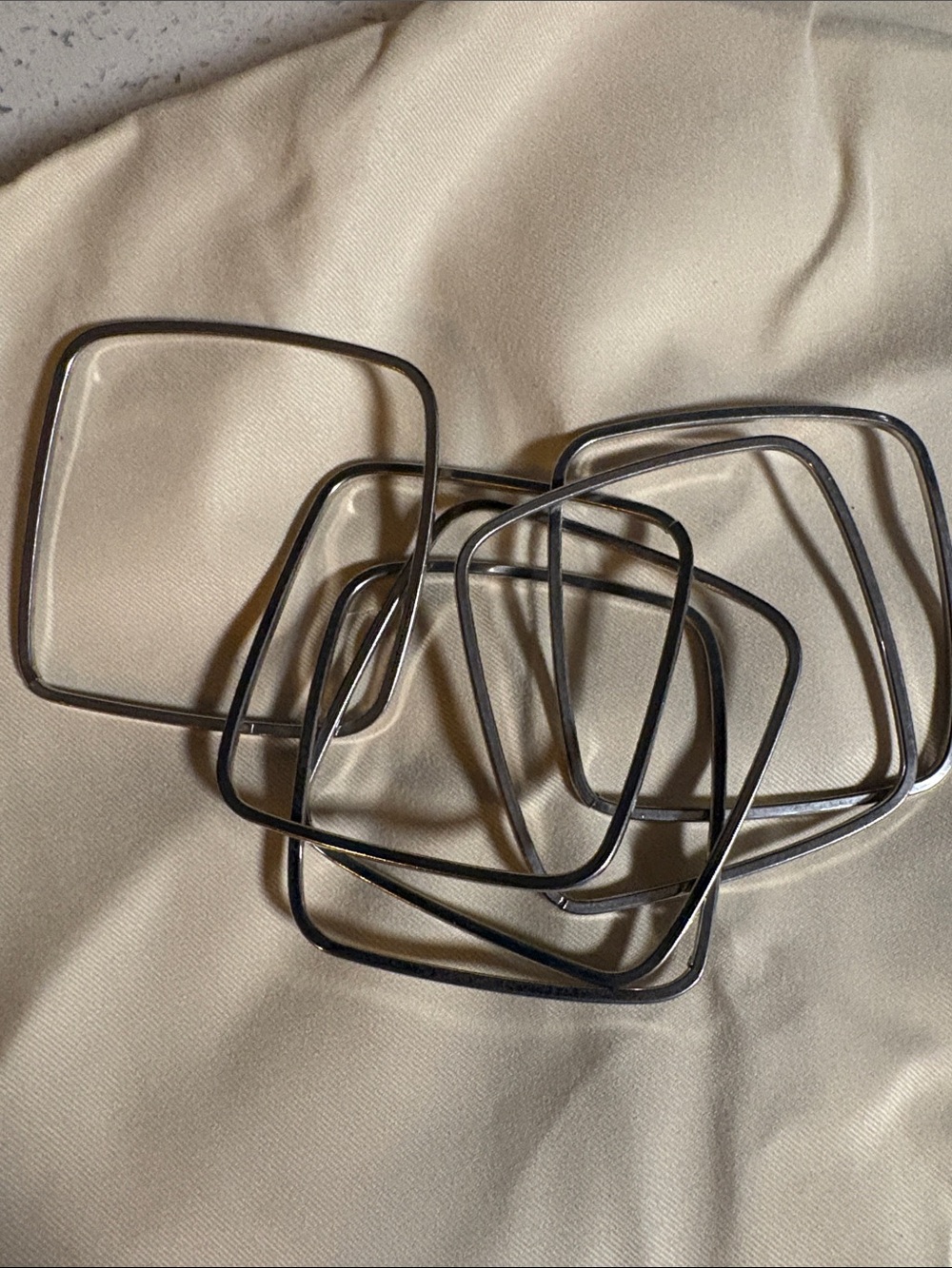 Six piece square bangles intertwined